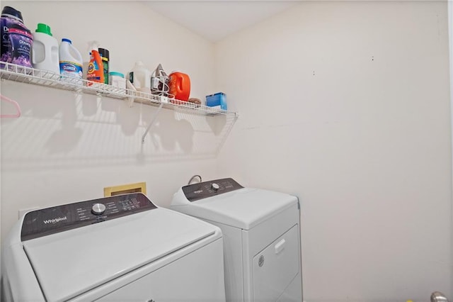 laundry area featuring laundry area and washer and clothes dryer