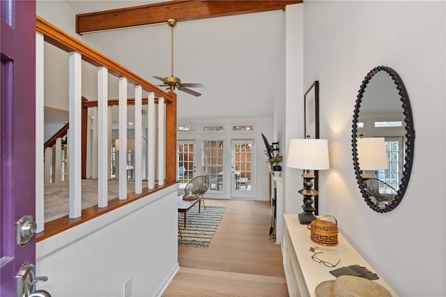 entryway featuring stairway, ceiling fan, high vaulted ceiling, light wood-type flooring, and beamed ceiling