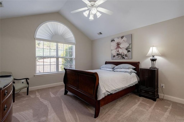 bedroom with vaulted ceiling, visible vents, and light carpet