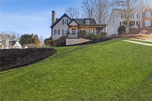 view of front of house featuring a porch and a front yard