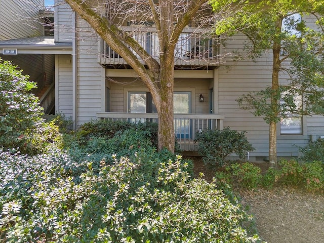 exterior space with crawl space and a balcony