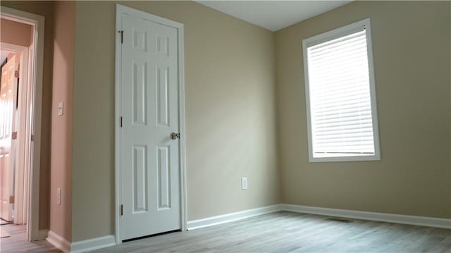 empty room with light wood-type flooring