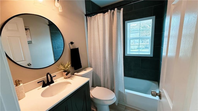 full bathroom with vanity, shower / bath combo, and toilet