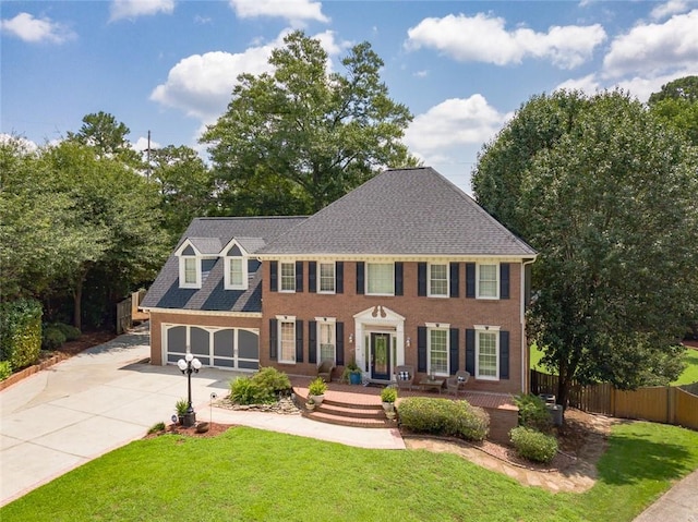 colonial-style house with a front yard