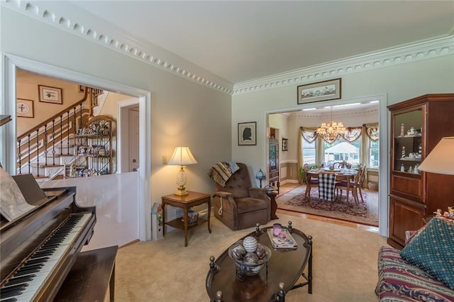 carpeted living room featuring a chandelier and ornamental molding