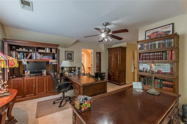 office space with light colored carpet and ceiling fan