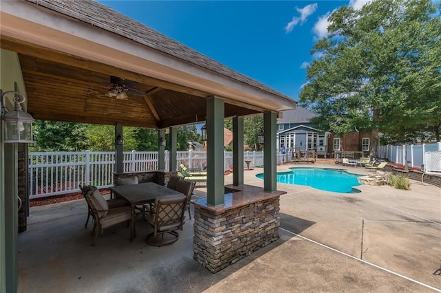 view of swimming pool featuring a patio area, ceiling fan, and a gazebo