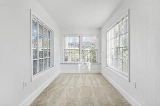 unfurnished sunroom featuring a healthy amount of sunlight