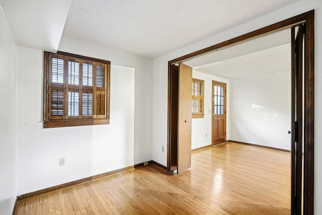 unfurnished room featuring light wood-type flooring