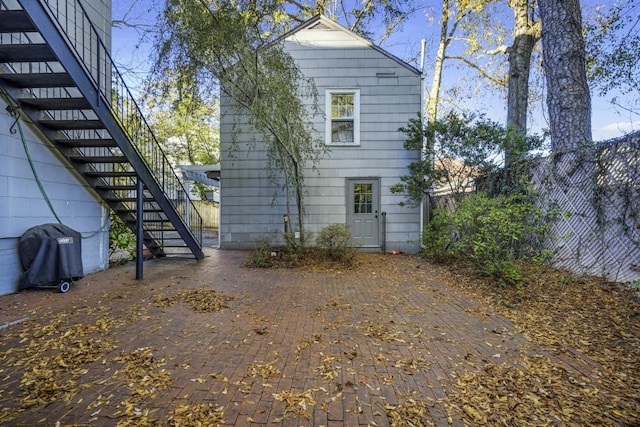 back of property featuring a patio area