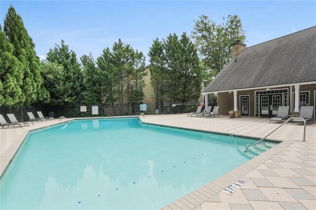 view of swimming pool with a patio