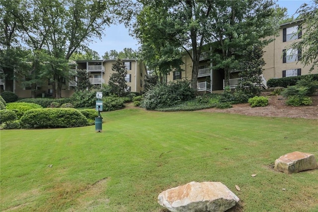 view of home's community featuring a yard