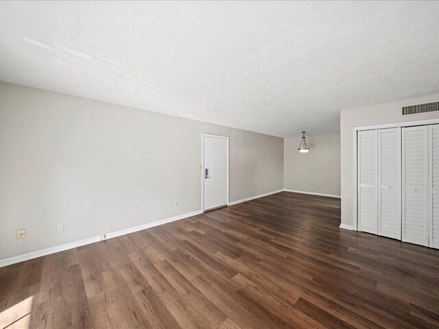 interior space with dark wood-type flooring