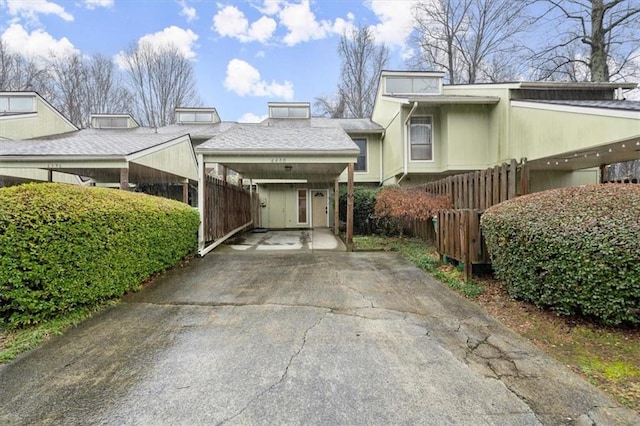 view of side of property with a carport