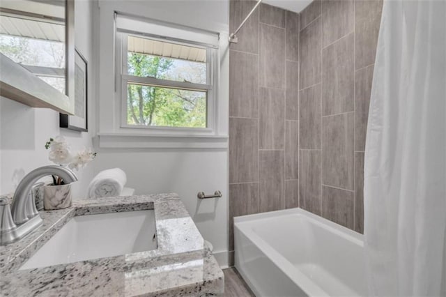 full bath featuring vanity and shower / bath combination with curtain