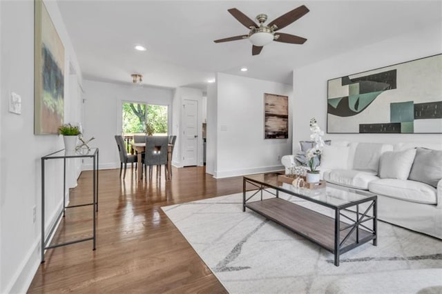 living room with recessed lighting, baseboards, a ceiling fan, and wood finished floors