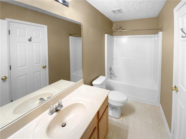 full bathroom with a textured ceiling, tub / shower combination, vanity, and toilet