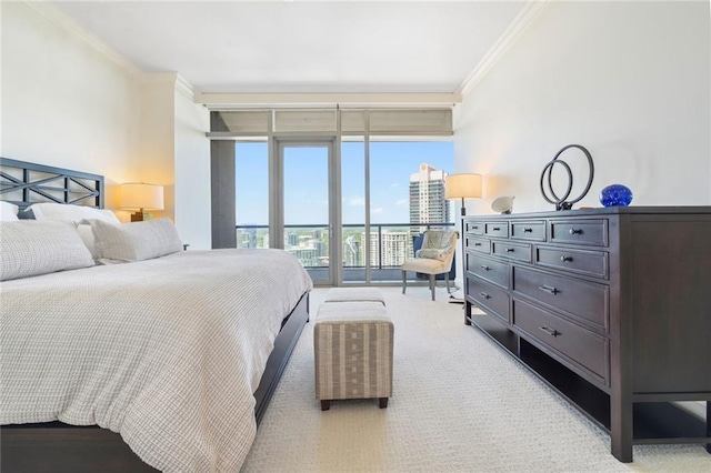 bedroom featuring ornamental molding, expansive windows, access to exterior, and light colored carpet