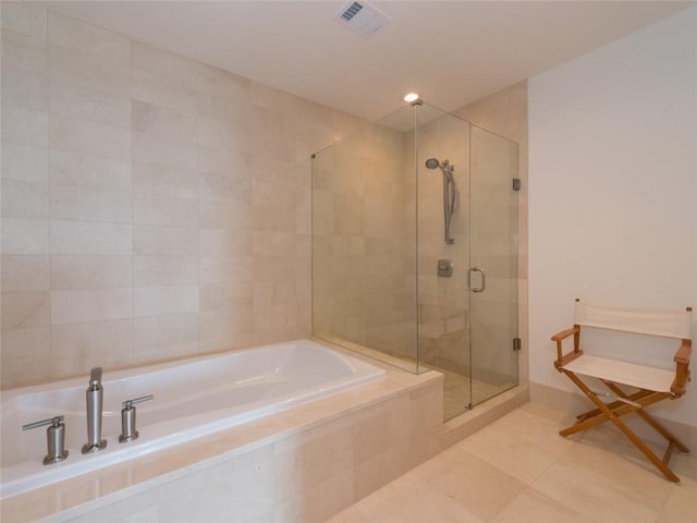 full bath featuring a stall shower, visible vents, a bath, and tile patterned floors