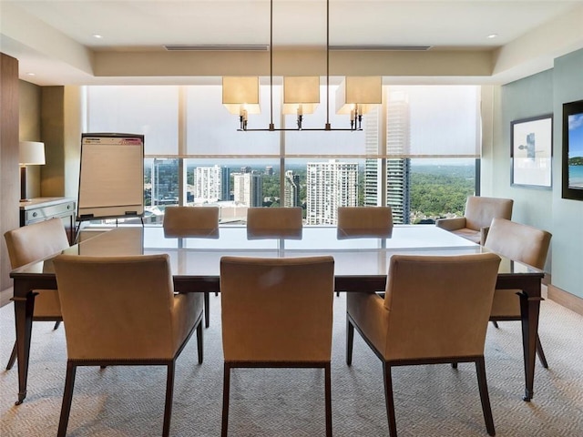 3630 Peachtree Rd NE Unit 2305, Atlanta, GA 30326 - dining area featuring light carpet, a chandelier, and baseboards