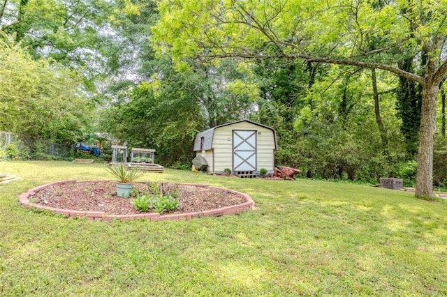view of yard with an outbuilding, a storage shed, and fence