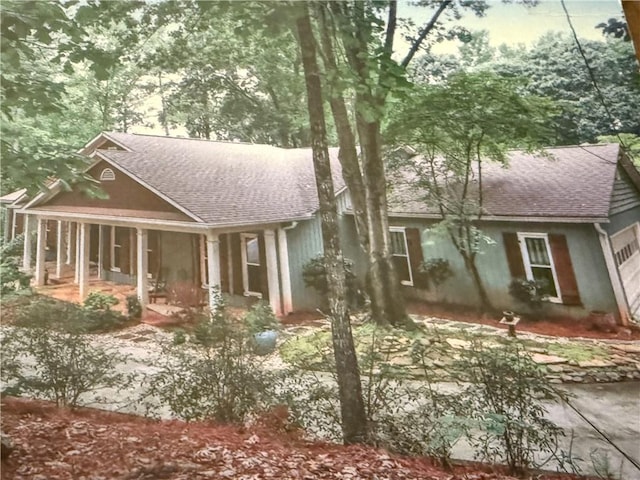 722 Beauregard Dr SW, Marietta, GA 30064 - view of front facade with a porch and roof with shingles