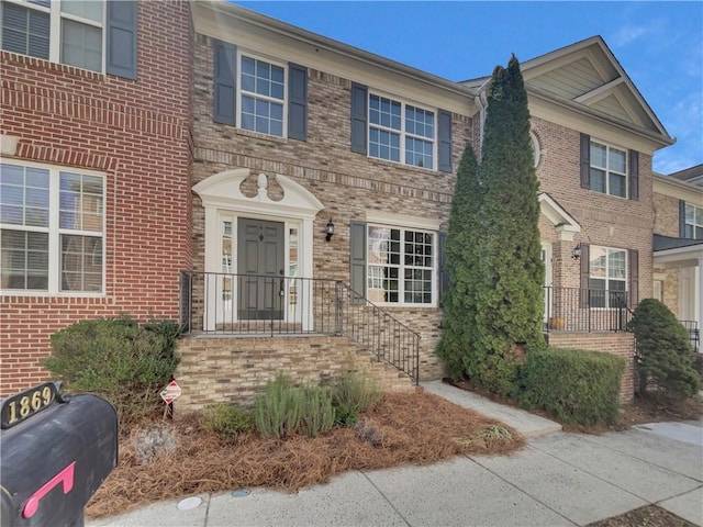 view of front of house featuring brick siding