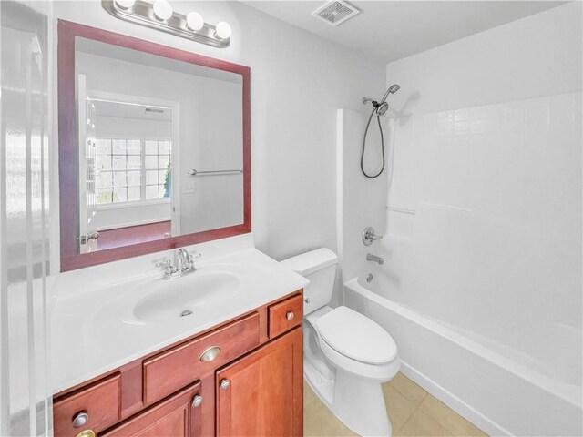 bathroom featuring visible vents, tub / shower combination, toilet, and vanity