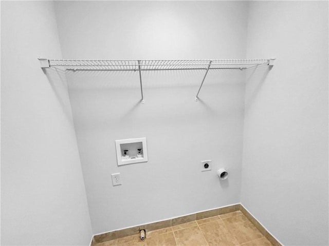 washroom featuring baseboards, laundry area, electric dryer hookup, washer hookup, and tile patterned floors