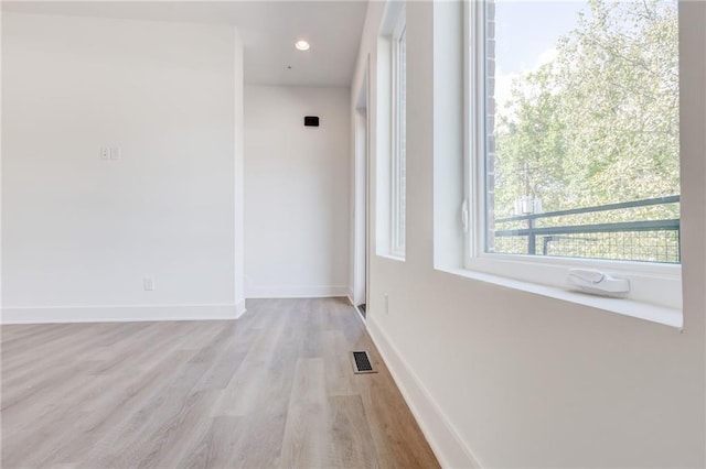 hall with light hardwood / wood-style flooring