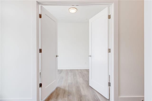 hall with light hardwood / wood-style flooring