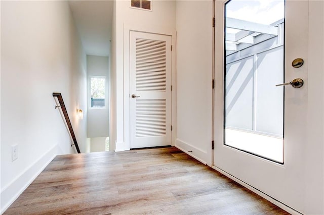 doorway with light hardwood / wood-style floors