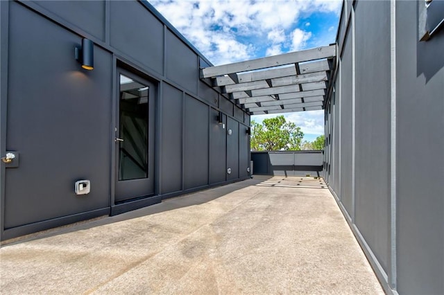 view of side of property featuring a patio area