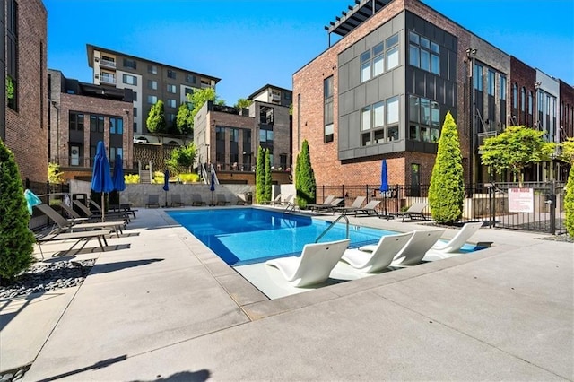 view of swimming pool with a patio