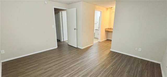 5595 Marbut Rd, Lithonia, GA 30058 - unfurnished room with dark wood-type flooring and baseboards