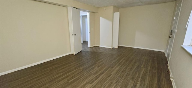 5595 Marbut Rd, Lithonia, GA 30058 - empty room with dark wood finished floors and baseboards