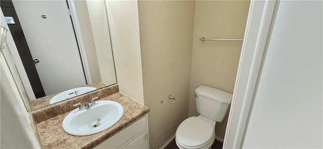 5595 Marbut Rd, Lithonia, GA 30058 - half bathroom featuring vanity and toilet