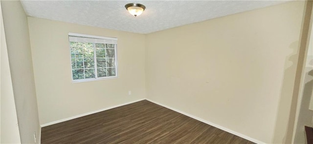 5595 Marbut Rd, Lithonia, GA 30058 - spare room with dark wood-type flooring and a textured ceiling