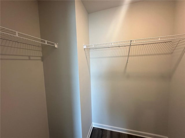 8664 Webb Rd, Riverdale, GA 30274 - walk in closet with dark wood-type flooring