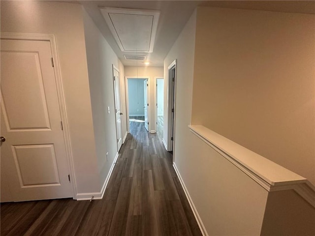8664 Webb Rd, Riverdale, GA 30274 - hallway with attic access, dark wood-type flooring, and baseboards