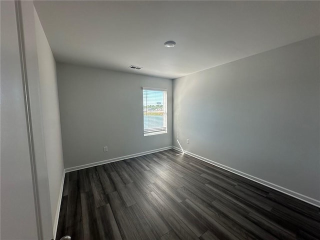 8664 Webb Rd, Riverdale, GA 30274 - empty room featuring dark wood finished floors and baseboards