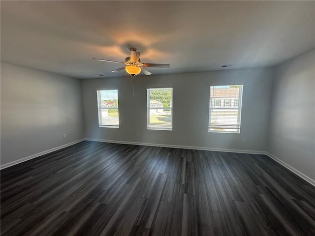8664 Webb Rd, Riverdale, GA 30274 - unfurnished room featuring dark wood finished floors, baseboards, and ceiling fan