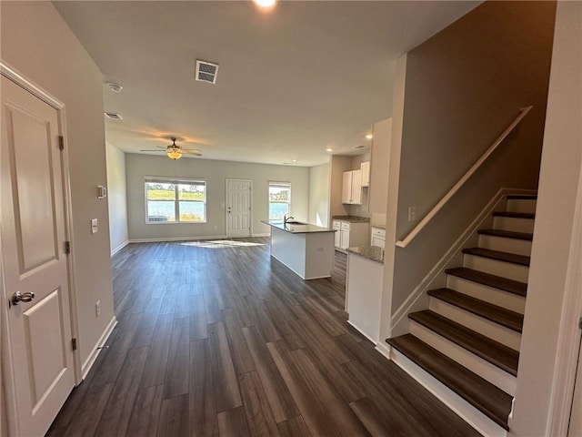 8664 Webb Rd, Riverdale, GA 30274 - unfurnished living room featuring baseboards, ceiling fan, dark wood-style floors, stairway, and recessed lighting