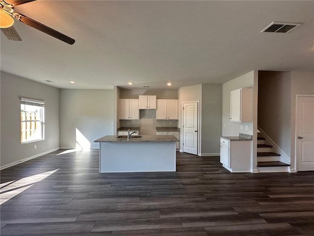 8664 Webb Rd, Riverdale, GA 30274 - kitchen featuring baseboards, white cabinetry, dark wood-type flooring, and recessed lighting