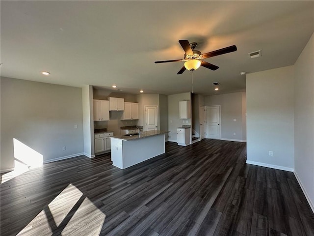 8664 Webb Rd, Riverdale, GA 30274 - kitchen featuring baseboards, a sink, white cabinetry, a ceiling fan, and dark wood-style floors