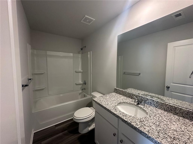 8664 Webb Rd, Riverdale, GA 30274 - bathroom featuring toilet, vanity, wood finished floors, and bathing tub / shower combination