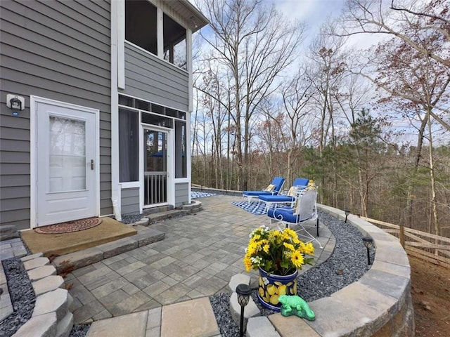 view of patio featuring a balcony