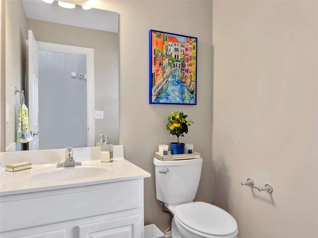 bathroom with vanity and toilet