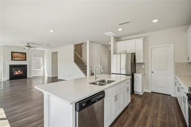 164 Long Leaf St, Dawsonville, GA 30534 - kitchen featuring visible vents, a sink, ceiling fan, appliances with stainless steel finishes, and a kitchen island with sink