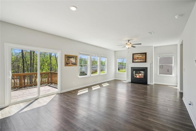 164 Long Leaf St, Dawsonville, GA 30534 - unfurnished living room featuring baseboards, a ceiling fan, and plenty of natural light